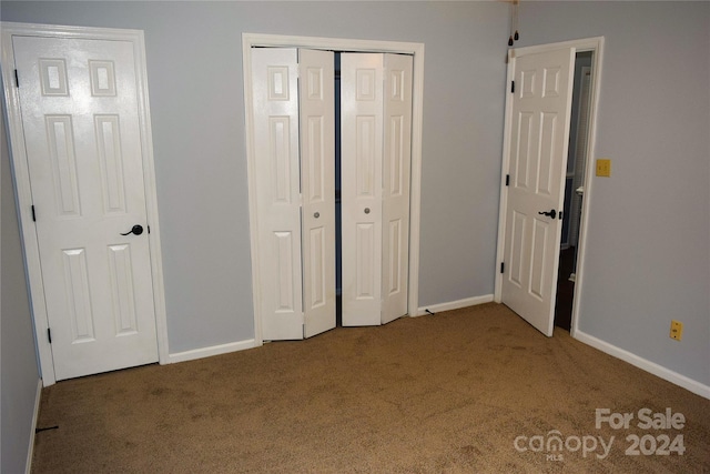 unfurnished bedroom featuring carpet