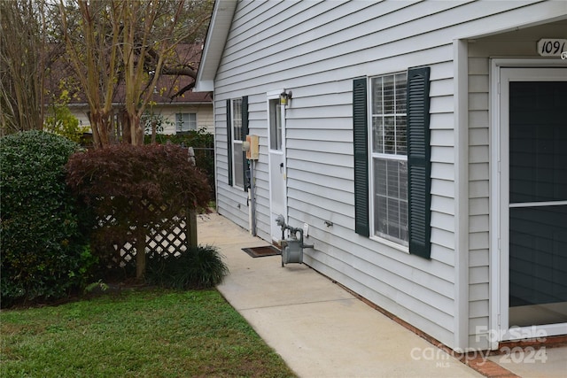 view of home's exterior with a yard