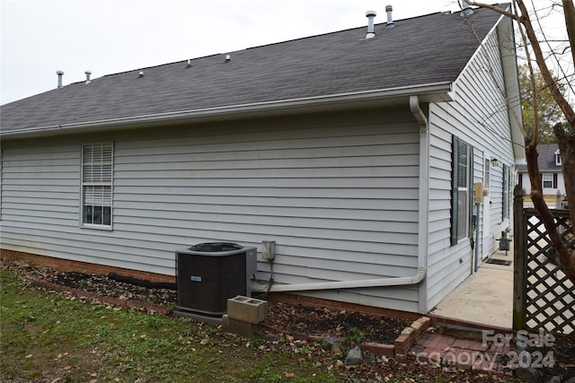 view of side of home with cooling unit