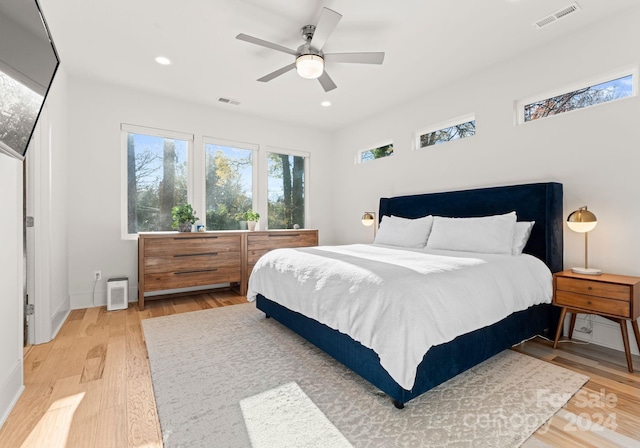 bedroom featuring ceiling fan and hardwood / wood-style floors