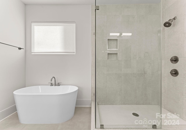 bathroom featuring separate shower and tub and tile patterned floors