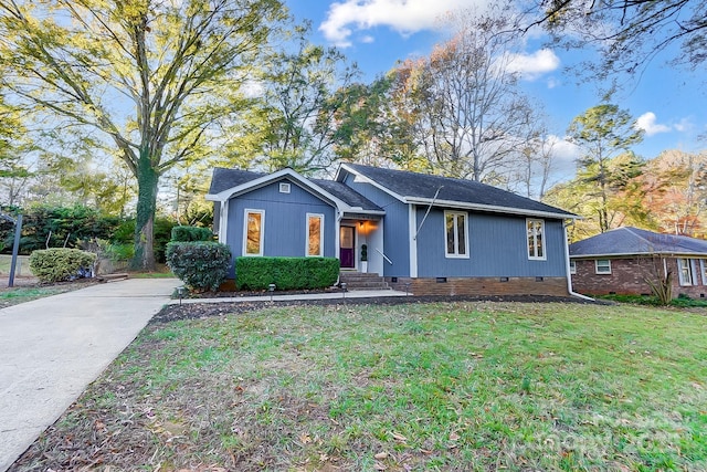 ranch-style house with a front yard