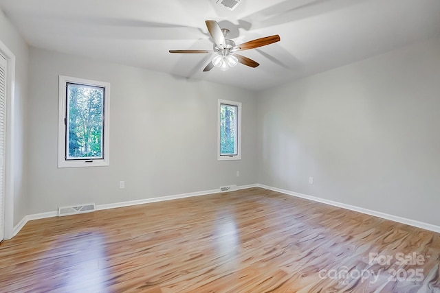 empty room with light hardwood / wood-style floors and ceiling fan