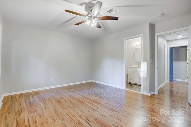 spare room with light hardwood / wood-style floors and ceiling fan