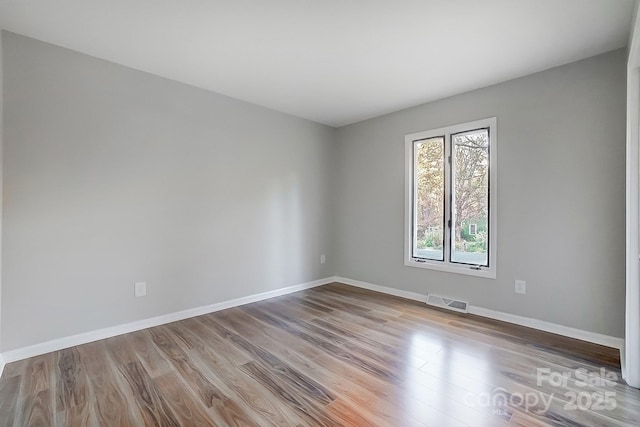 unfurnished room featuring light wood-type flooring