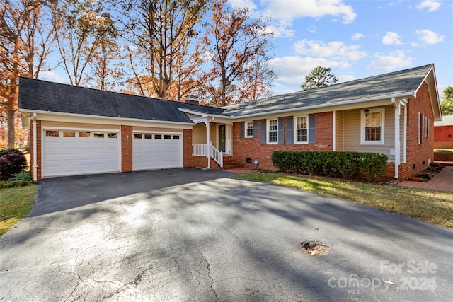 ranch-style home with a garage