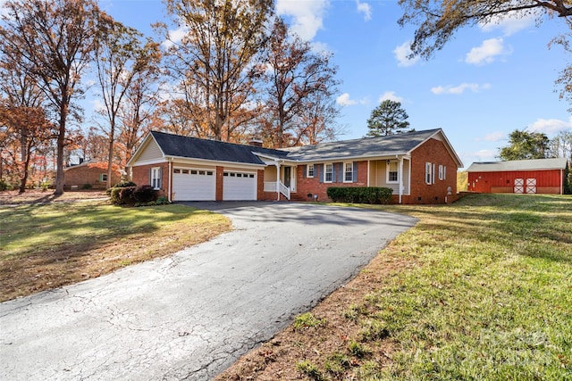 single story home with a front yard and a garage