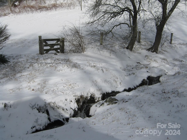 view of yard layered in snow