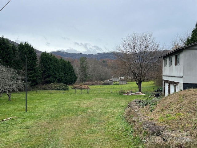 view of yard featuring a mountain view and a rural view