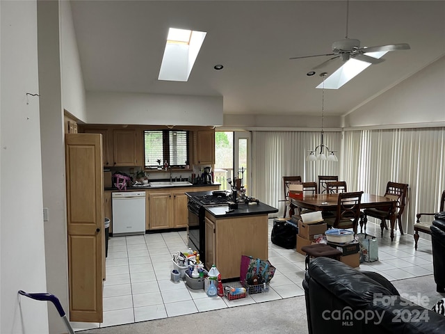 kitchen featuring a skylight, ceiling fan, dishwasher, and sink