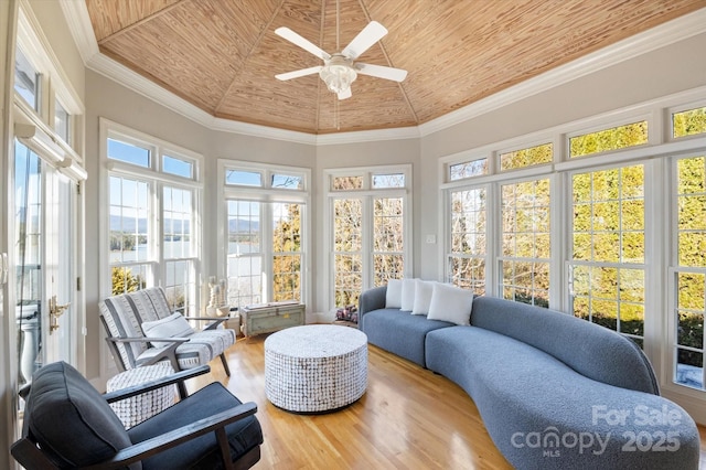 sunroom / solarium with wood ceiling and ceiling fan