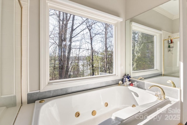 bathroom featuring ornamental molding and tiled bath