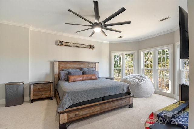 carpeted bedroom with crown molding and ceiling fan