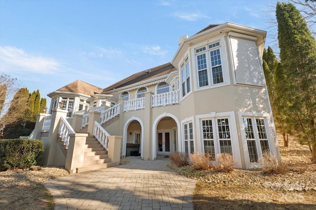 view of front of home with a patio area and french doors