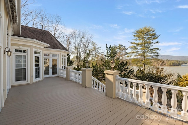 wooden deck with a mountain view and french doors