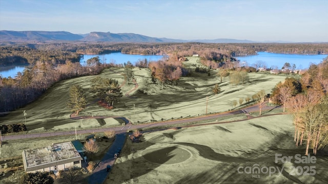 aerial view featuring a water and mountain view