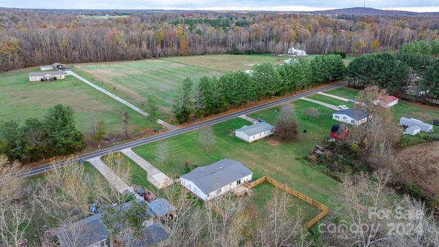 birds eye view of property featuring a rural view