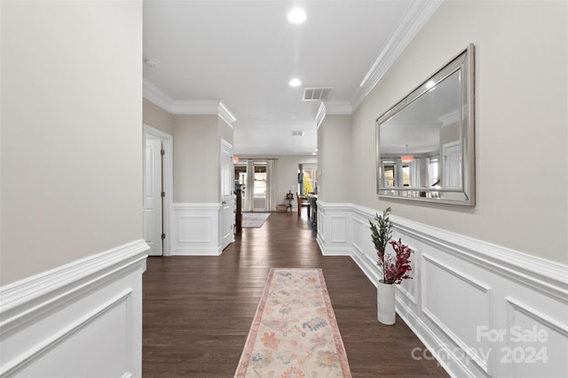 corridor with dark hardwood / wood-style flooring, french doors, and ornamental molding