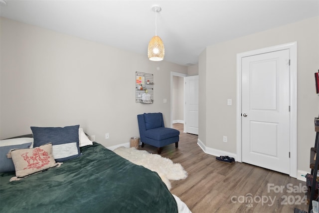 bedroom with hardwood / wood-style flooring