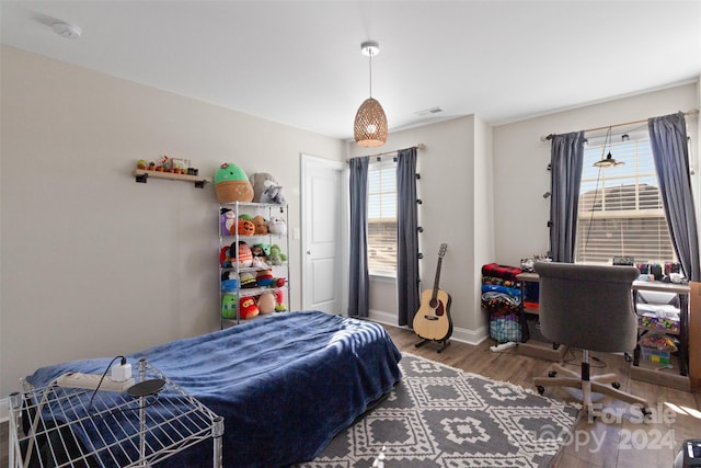 bedroom featuring hardwood / wood-style flooring