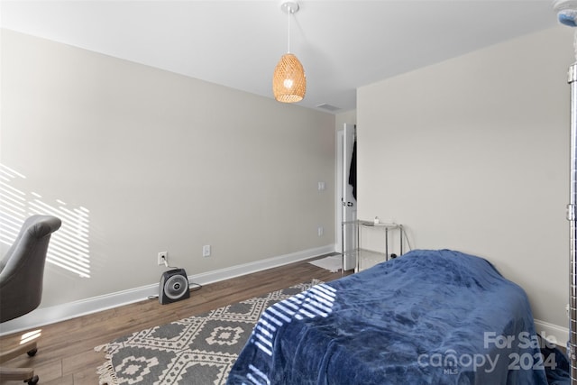 bedroom featuring dark hardwood / wood-style flooring