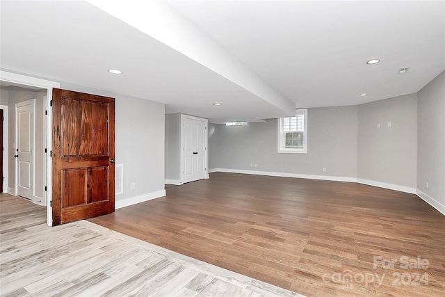 unfurnished room with light wood-type flooring