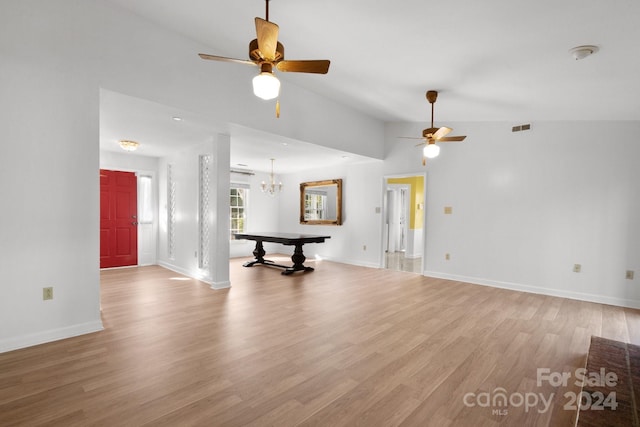 unfurnished living room featuring pool table, lofted ceiling, and light wood-type flooring