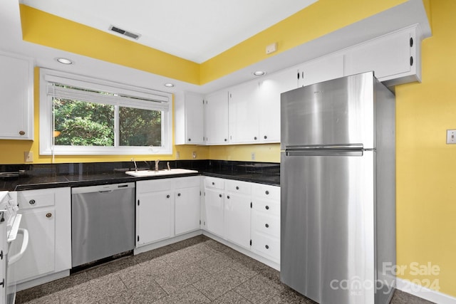 kitchen featuring white cabinets, sink, and stainless steel appliances