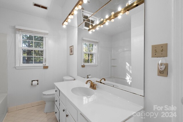 full bathroom with tile patterned floors, vanity,  shower combination, and toilet