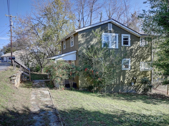 view of home's exterior featuring a yard