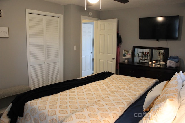 bedroom with ceiling fan and a closet