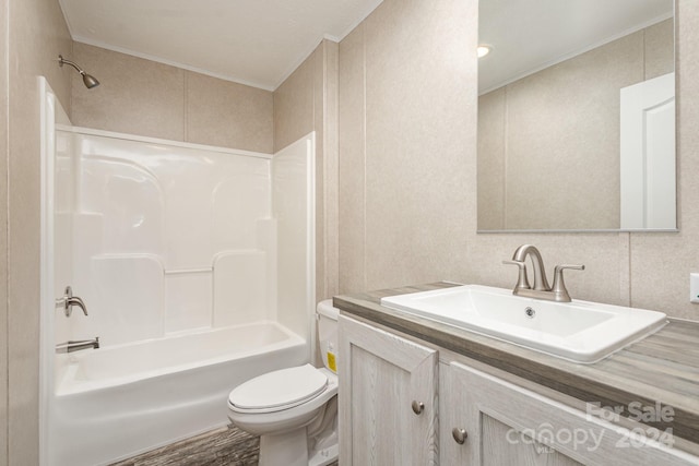 full bathroom with shower / bathtub combination, vanity, crown molding, hardwood / wood-style floors, and toilet