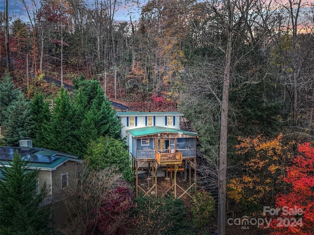 291 Tryon Bay Cir, Lake Lure, NC 28746 - rear view of property featuring a metal roof, a wooded view, and a deck