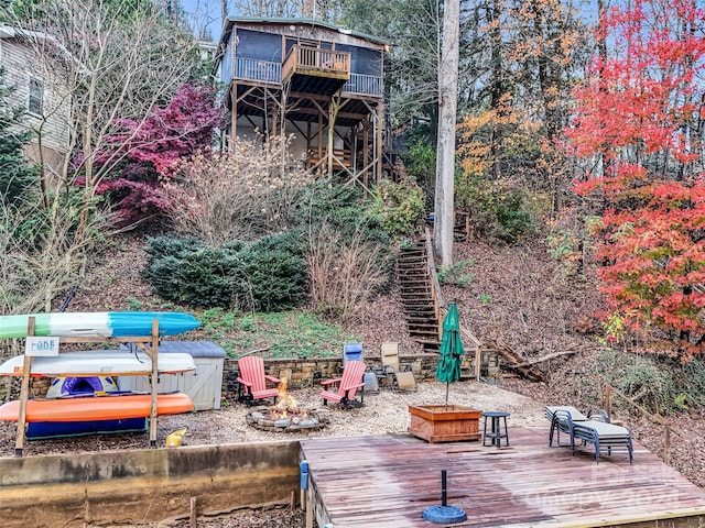 291 Tryon Bay Cir, Lake Lure, NC 28746 - wooden deck featuring an outdoor fire pit