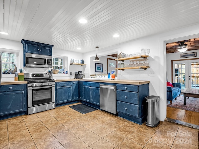 291 Tryon Bay Cir, Lake Lure, NC 28746 - kitchen featuring appliances with stainless steel finishes, blue cabinetry, wooden ceiling, and recessed lighting