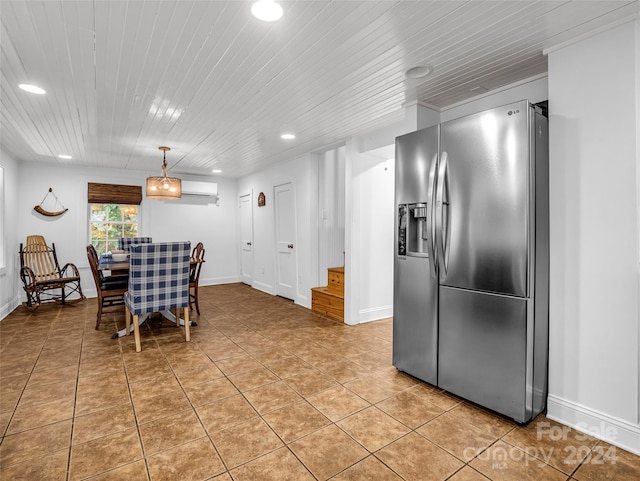 tiled dining space featuring an AC wall unit