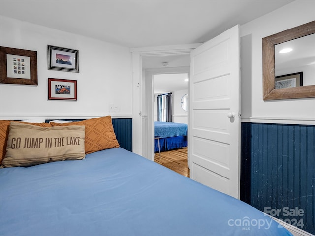 bedroom with hardwood / wood-style floors