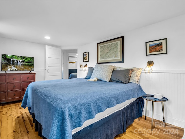 291 Tryon Bay Cir, Lake Lure, NC 28746 - bedroom with wood finished floors, wainscoting, and recessed lighting