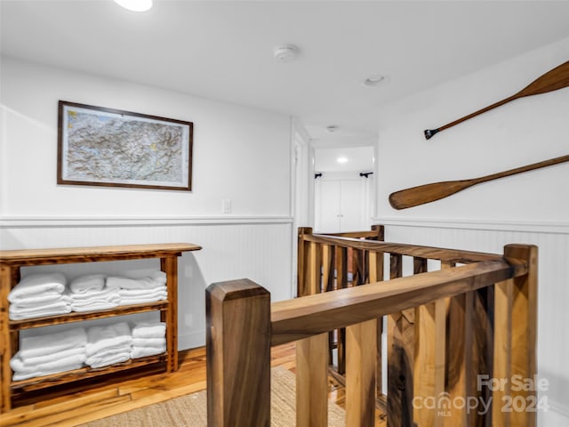 291 Tryon Bay Cir, Lake Lure, NC 28746 - corridor featuring wainscoting, an upstairs landing, wood finished floors, and recessed lighting