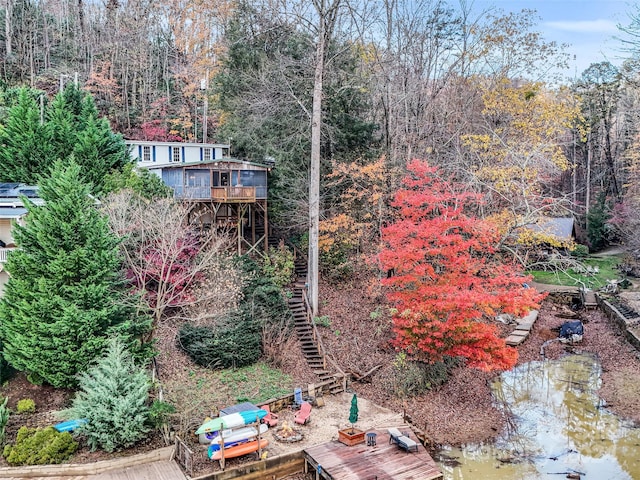 291 Tryon Bay Cir, Lake Lure, NC 28746 - view of yard with stairway, a boat dock, and a deck