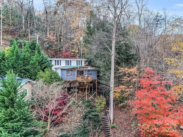 291 Tryon Bay Cir, Lake Lure, NC 28746 - rear view of house with stairs, a deck, and a forest view