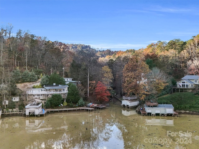 birds eye view of property with a water view