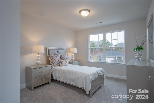 bedroom with light carpet