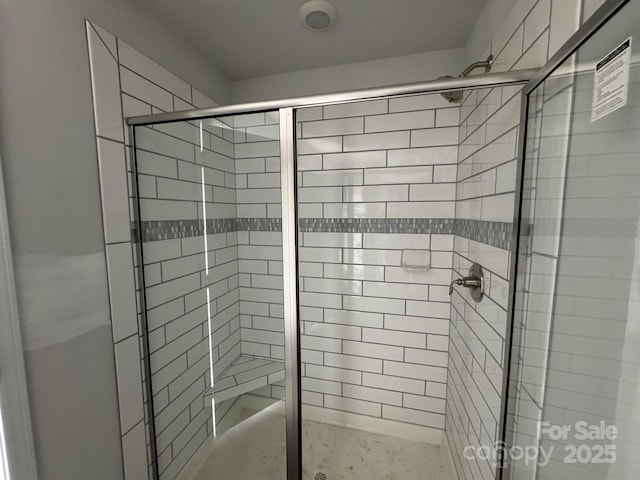 bathroom with a shower stall