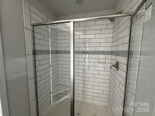 bathroom with a shower stall