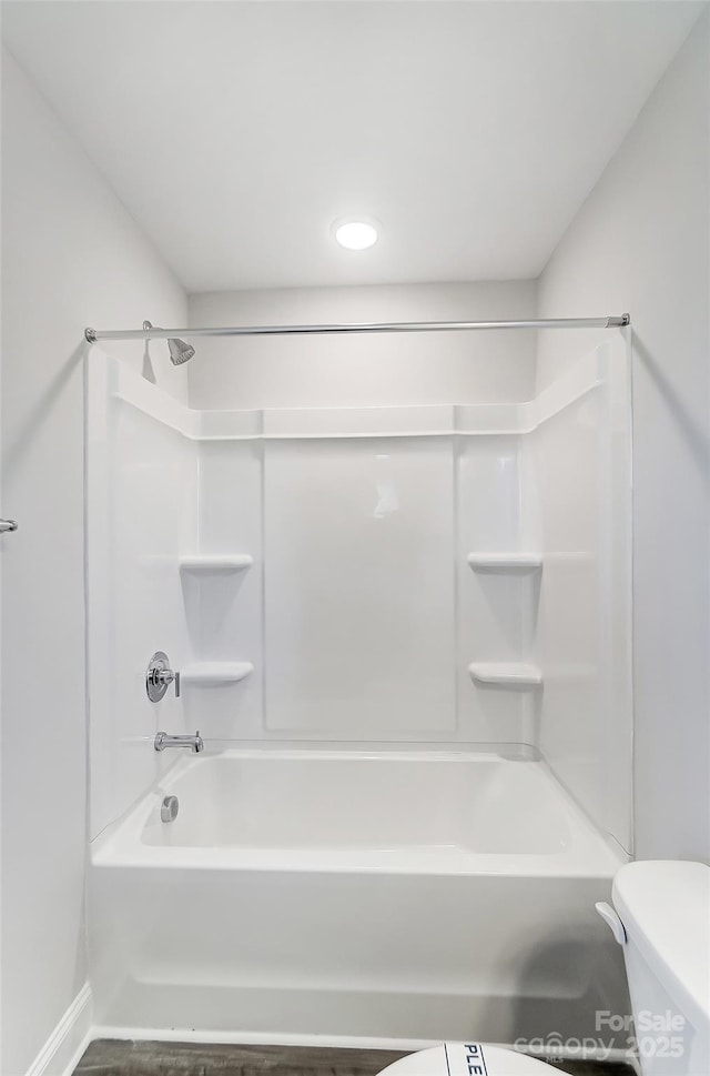 full bathroom featuring shower / bathing tub combination and toilet