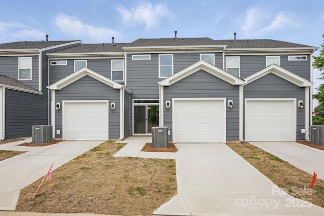 multi unit property featuring concrete driveway and cooling unit