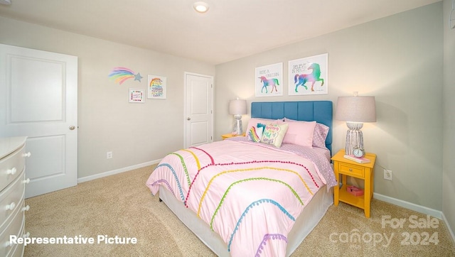 bedroom with light colored carpet