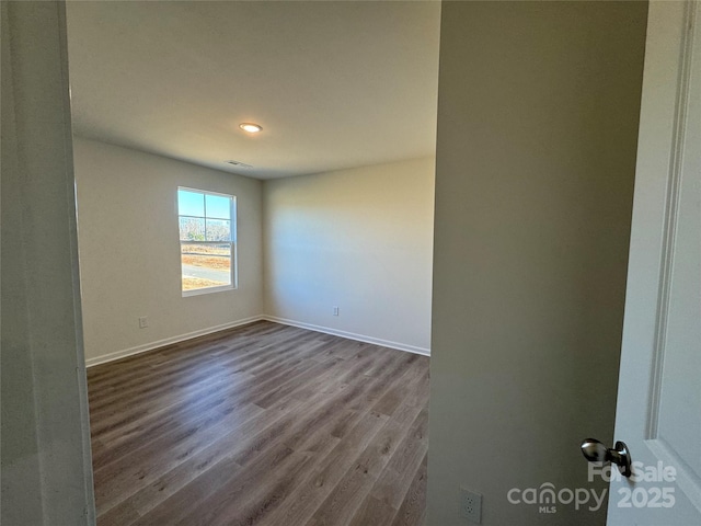 unfurnished room featuring wood-type flooring