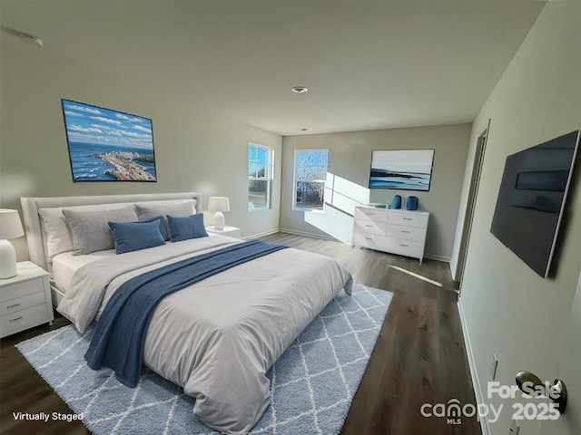 bedroom featuring dark hardwood / wood-style flooring